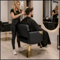 Czarno złoty fotel fryzjerski barberski kosmetyczny z podnóżkiem PENRYN  (1).jpg