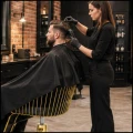 Czarno złoty fotel fryzjerski barberski kosmetyczny z podnóżkiem LYME (8).jpg
